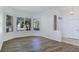 Bright living room with wood flooring and multiple windows at 8981 Rivers Edge Dr, Las Vegas, NV 89117