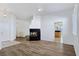 Open-concept living room featuring fireplace and natural light at 8981 Rivers Edge Dr, Las Vegas, NV 89117