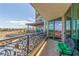 Balcony with iron railings and cushioned seating offering views of the city skyline at 9101 Alta Dr # 203, Las Vegas, NV 89145