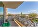 Balcony with ornate iron railings overlooking the city skyline and mountain views at 9101 Alta Dr # 203, Las Vegas, NV 89145