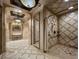Luxurious bathroom featuring tiled walls, glass shower, and modern fixtures at 9101 Alta Dr # 203, Las Vegas, NV 89145