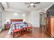 Cozy bedroom with hardwood floors, a ceiling fan, and view outside at 9101 Alta Dr # 203, Las Vegas, NV 89145