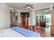 Bedroom featuring hardwood floors, balcony access, and furnishings at 9101 Alta Dr # 203, Las Vegas, NV 89145