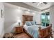 Comfortable bedroom with stylish decor, hardwood floors, and a serene atmosphere at 9101 Alta Dr # 203, Las Vegas, NV 89145