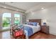 Bright bedroom with hardwood floors, large windows, and stylish furnishings at 9101 Alta Dr # 203, Las Vegas, NV 89145