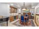 Dining room with custom wood cabinets, wet bar, wine fridge and grand piano at 9101 Alta Dr # 203, Las Vegas, NV 89145