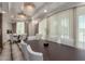 Formal dining room featuring elegant lighting, spacious table, and large windows at 9101 Alta Dr # 203, Las Vegas, NV 89145