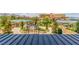 Beautifully landscaped grounds with a gazebo and multiple outbuildings with a larger building in the background at 9101 Alta Dr # 203, Las Vegas, NV 89145