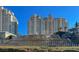 High-rise condo with landscaped fountain, lush plantings, and manicured shrubs at 9101 Alta Dr # 203, Las Vegas, NV 89145