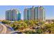Two luxurious high-rise condominium towers surrounded by lush landscaping and manicured grounds at 9101 Alta Dr # 203, Las Vegas, NV 89145