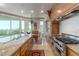 Gourmet kitchen with granite countertops, stainless steel appliances, and views of the outside at 9101 Alta Dr # 203, Las Vegas, NV 89145