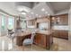 Gourmet kitchen with stone countertops, stainless steel appliances, and breakfast nook at 9101 Alta Dr # 203, Las Vegas, NV 89145