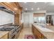Gourmet kitchen with stainless steel oven, granite countertops and breakfast bar at 9101 Alta Dr # 203, Las Vegas, NV 89145
