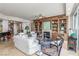 Spacious living room featuring fireplace, built-in shelving and doors to balcony at 9101 Alta Dr # 203, Las Vegas, NV 89145