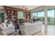 Cozy living room features a fireplace with built-in shelving and a balcony at 9101 Alta Dr # 203, Las Vegas, NV 89145