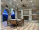 Covered patio area with stone columns, a dining set, and scenic views at 9101 Alta Dr # 203, Las Vegas, NV 89145