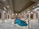 Stunning indoor plunge pool with tiled flooring, columns, and decorative lighting at 9101 Alta Dr # 203, Las Vegas, NV 89145
