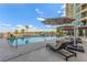 Relaxing pool area with lounge chairs and umbrellas, perfect for enjoying the sun and views at 9101 Alta Dr # 203, Las Vegas, NV 89145