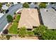 Aerial view of the backyard featuring a home, a covered patio, and mature trees at 913 Hickory Park St, Las Vegas, NV 89138