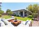 Lush backyard with a covered patio and comfortable seating area at 913 Hickory Park St, Las Vegas, NV 89138