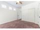 Standard bedroom featuring a closet and plantation shutters at 913 Hickory Park St, Las Vegas, NV 89138