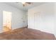 Bright bedroom featuring a ceiling fan, double door closet, and neutral carpet at 913 Hickory Park St, Las Vegas, NV 89138