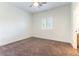 Cozy bedroom with a window featuring plantation shutters at 913 Hickory Park St, Las Vegas, NV 89138