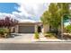 Attractive single-story home featuring desert landscaping, a two-car garage, and a tiled roof at 913 Hickory Park St, Las Vegas, NV 89138
