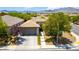 Beautiful single-story home with desert landscaping, a two-car garage, and a tile roof at 913 Hickory Park St, Las Vegas, NV 89138