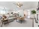 Bright, open-concept living room with a modern fireplace and neutral decor at 913 Hickory Park St, Las Vegas, NV 89138