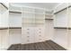 Custom walk-in closet with built-in shelving and drawers for ample storage at 913 Hickory Park St, Las Vegas, NV 89138