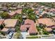 An aerial view shows the home's tile roof, solar panels, and well-manicured desert landscaping at , Las Vegas, NV 89113