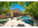 Expansive backyard featuring a sparkling pool, outdoor kitchen, and patio, perfect for relaxation and entertaining at , Las Vegas, NV 89113