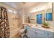 A clean bathroom featuring shower-tub combo, patterned curtains and single sink vanity at , Las Vegas, NV 89113