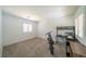 A clean and empty bedroom with a modern electric bike and minimalist desk at , Las Vegas, NV 89113