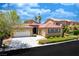 Beautiful single-Gathering home with a well-maintained lawn, a two-car garage, and desert landscaping at , Las Vegas, NV 89113
