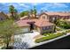 Inviting single-story home showcasing a tile roof, a two-car garage, and desert landscaping at , Las Vegas, NV 89113