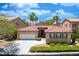 Charming single-story home with a well-manicured lawn, a two-car garage, and a beautiful tile roof at , Las Vegas, NV 89113