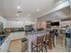 Bright, open kitchen with stainless steel appliances, white cabinetry, and a breakfast bar with seating at , Las Vegas, NV 89113