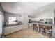 Spacious kitchen with white cabinets, stainless steel appliances, tiled floor, and breakfast bar with seating at , Las Vegas, NV 89113
