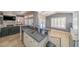 Well-lit kitchen with stainless steel sink, ample counter space, breakfast bar, and backyard view at , Las Vegas, NV 89113