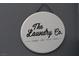 A decorative 'The Laundry Co.' sign adds a cozy touch to the laundry space at , Las Vegas, NV 89113