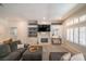 Inviting living room with a fireplace, shelving, and natural light from shuttered windows at , Las Vegas, NV 89113