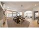 Open-concept living area with lots of windows, neutral decor, and tiled flooring at , Las Vegas, NV 89113