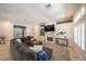 Spacious living area with fireplace, custom built-ins, and large windows at , Las Vegas, NV 89113