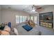 Bright main bedroom featuring a ceiling fan, neutral carpet, and access to the backyard patio at , Las Vegas, NV 89113