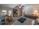 Spacious main bedroom with neutral tones, a ceiling fan, and an adjacent massage chair at , Las Vegas, NV 89113