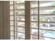 Close-up of plantation shutters overlooking the backyard pool and landscaping at , Las Vegas, NV 89113