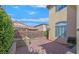 Cozy backyard with brick-paved patio, lush landscaping and a built-in BBQ area at 10001 Blairwood Ct, Las Vegas, NV 89178