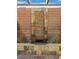 Attractive stone water feature set in a brick wall, adding a natural element to the backyard at 10001 Blairwood Ct, Las Vegas, NV 89178